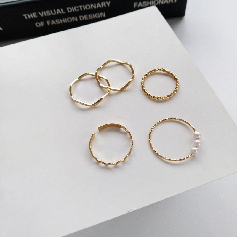 Collection of Gold Color Round Hollow Geometric Rings in a gallery layout