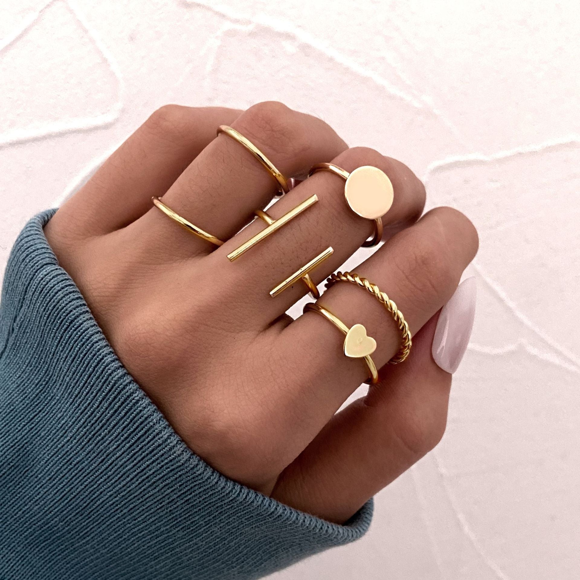 Collection of Gold Color Round Hollow Geometric Rings in a gallery layout