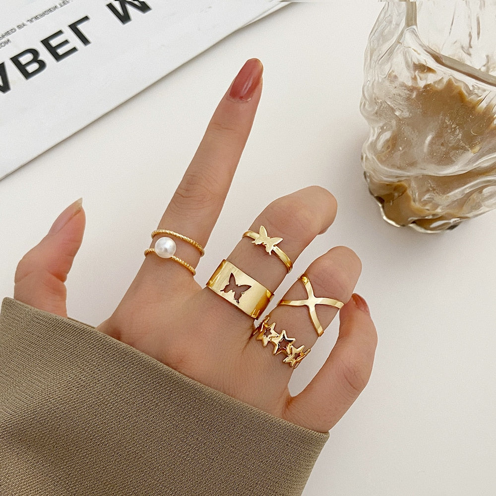 Collection of Gold Color Round Hollow Geometric Rings in a gallery layout