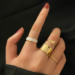 Collection of Gold Color Round Hollow Geometric Rings in a gallery layout