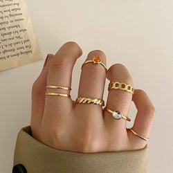 Collection of Gold Color Round Hollow Geometric Rings in a gallery layout